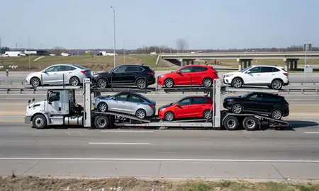 Multi-level car carrier on the highway to Buffalo, New York, United States