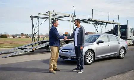 Vehicle owner beside their delivered car in Buffalo, New York, United States