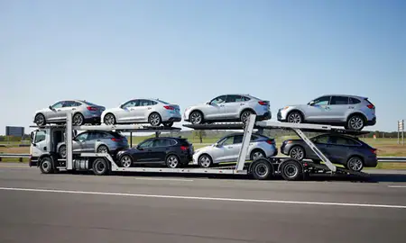 Multi-level car carrier on the highway to Glens Falls, New York, United States