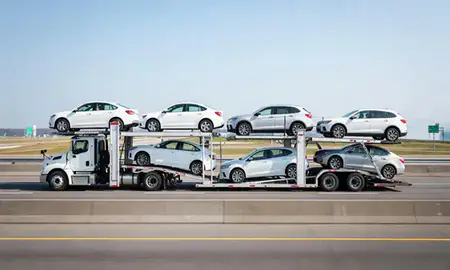 Multi-level car carrier on the highway to Niagara Falls, New York, United States