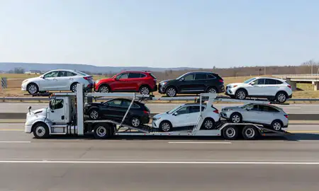 Multi-level car carrier on the highway to Poughkeepsie, New York, United States