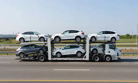 Multi-level car carrier on the highway to Schenectady, New York, United States