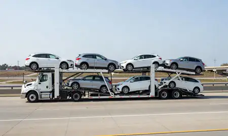 Multi-level car carrier on the highway to Syracuse, New York, United States