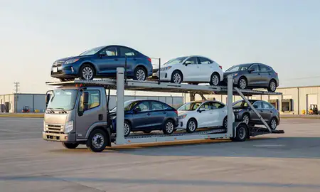 Car transporter loaded with vehicles in Utica, New York, United States