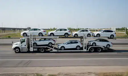 Multi-level car carrier on the highway to Valley Stream, New York, United States
