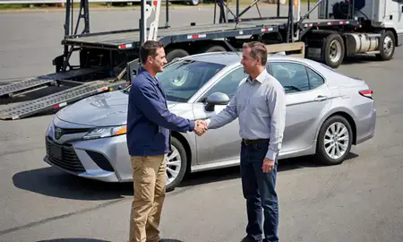 Vehicle owner beside their delivered car in Valley Stream, New York, United States