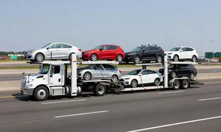 Multi-level car carrier on the highway to Yonkers, New York, United States