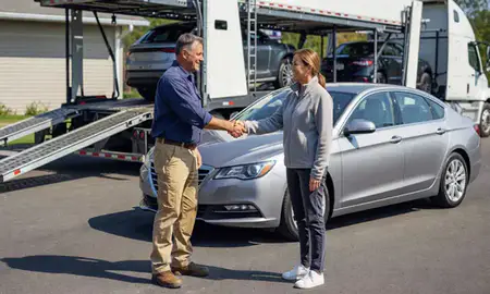 Vehicle owner beside their delivered car in North Carolina, United States