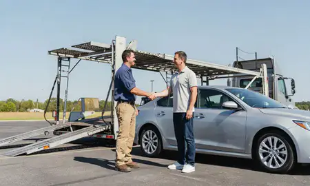 Vehicle owner beside their delivered car in Apex, North Carolina, United States