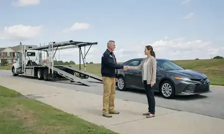 Vehicle owner beside their delivered car in Burlington, North Carolina, United States