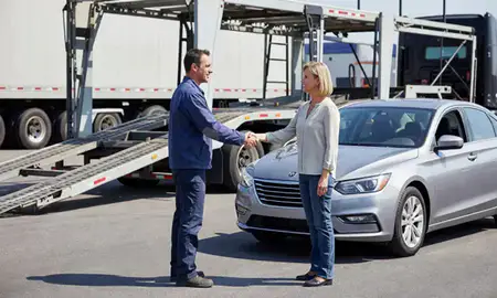 Vehicle owner beside their delivered car in Cary, North Carolina, United States