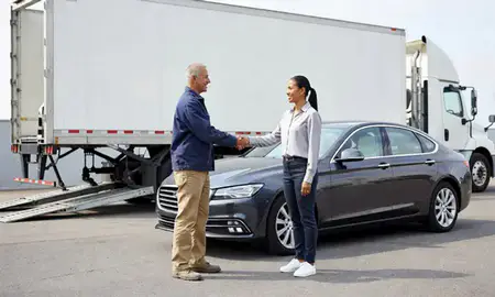 Vehicle owner beside their delivered car in Concord, North Carolina, United States