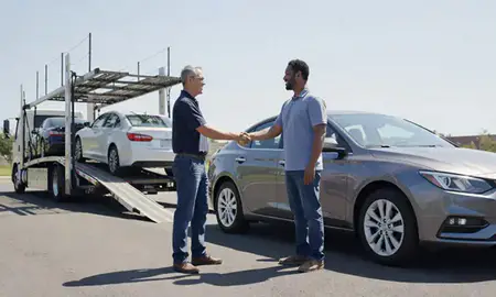 Vehicle owner beside their delivered car in Durham, North Carolina, United States