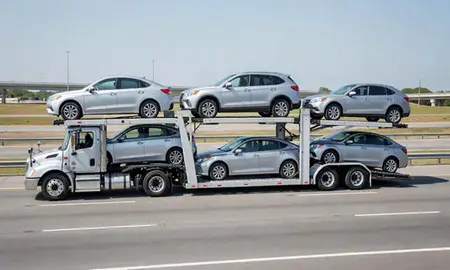 Multi-level car carrier on the highway to Fayetteville, North Carolina, United States