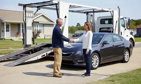 Vehicle owner beside their delivered car in Fayetteville, North Carolina, United States