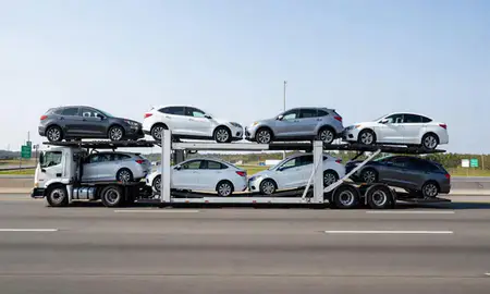 Multi-level car carrier on the highway to Gastonia, North Carolina, United States