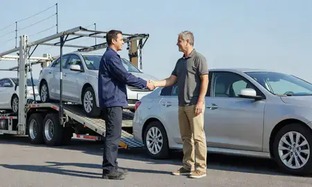 Vehicle owner beside their delivered car in Gastonia, North Carolina, United States