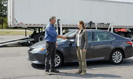 Vehicle owner beside their delivered car in Hickory, North Carolina, United States
