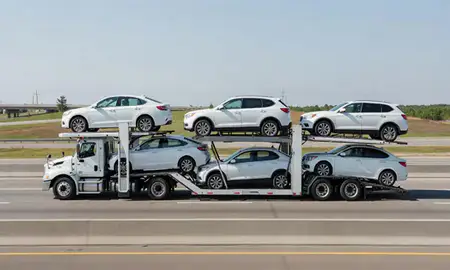 Multi-level car carrier on the highway to High Point, North Carolina, United States