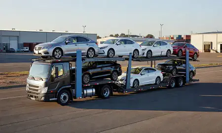 Car transporter loaded with vehicles in High Point, North Carolina, United States