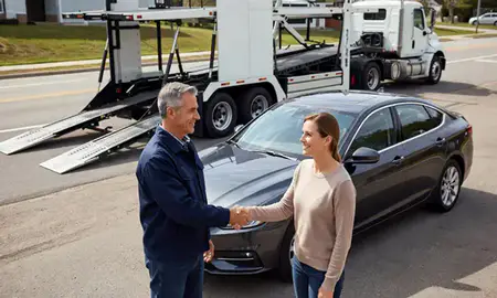 Vehicle owner beside their delivered car in Huntersville, North Carolina, United States