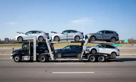Multi-level car carrier on the highway to Monroe, North Carolina, United States