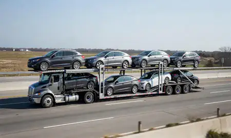 Multi-level car carrier on the highway to Wilmington, North Carolina, United States