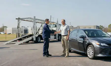 Vehicle owner beside their delivered car in Winston-Salem, North Carolina, United States