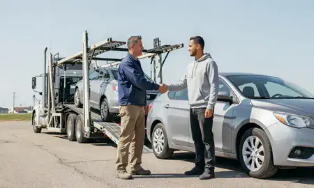 Vehicle owner beside their delivered car in Beulah, North Dakota, United States