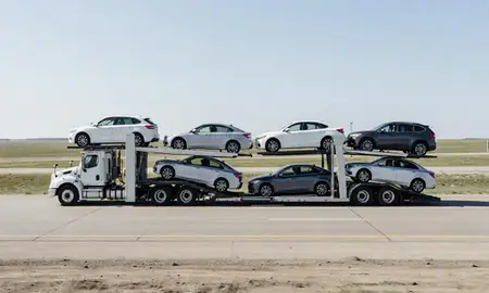 Multi-level car carrier on the highway to Bismarck, North Dakota, United States