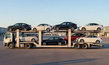 Car transporter parked in an industrial area of Bottineau, North Dakota, United States