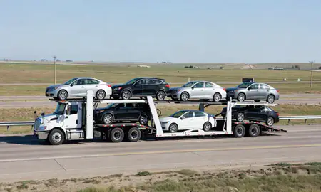 Multi-level car carrier on the highway to Casselton, North Dakota, United States