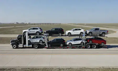 Multi-level car carrier on the highway to Fargo, North Dakota, United States