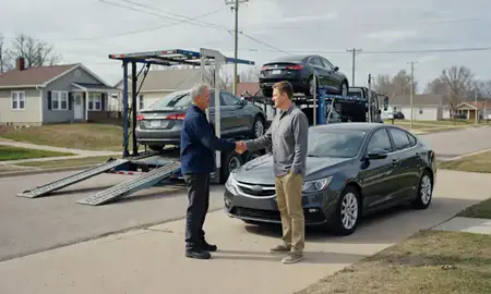 Vehicle owner beside their delivered car in Grafton, North Dakota, United States