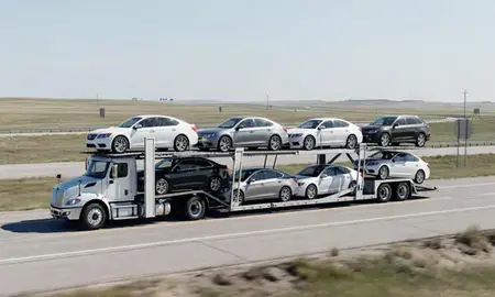 Multi-level car carrier on the highway to Grand Forks AFB, North Dakota, United States