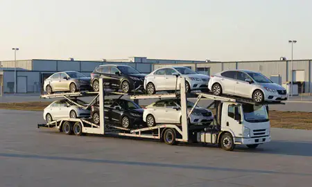 Car transporter loaded with vehicles in Grand Forks AFB, North Dakota, United States