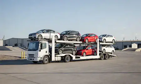 Car transporter loaded with vehicles in Harvey, North Dakota, United States