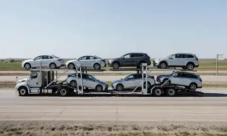 Multi-level car carrier on the highway to Jamestown, North Dakota, United States