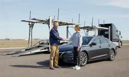 Vehicle owner beside their delivered car in Jamestown, North Dakota, United States