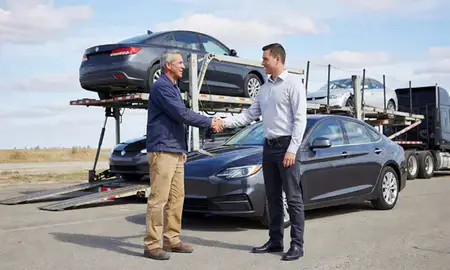Vehicle owner beside their delivered car in Mandan, North Dakota, United States