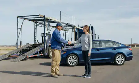 Vehicle owner beside their delivered car in Mayville, North Dakota, United States