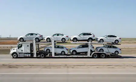Multi-level car carrier on the highway to Minot AFB, North Dakota, United States