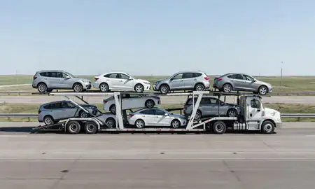 Multi-level car carrier on the highway to Minot, North Dakota, United States