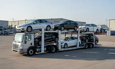 Car transporter loaded with vehicles in New Town, North Dakota, United States