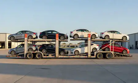 Car transporter parked in an industrial area of Oakes, North Dakota, United States