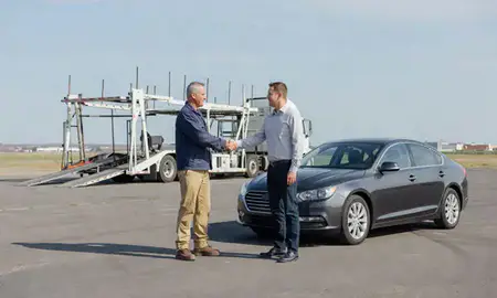 Vehicle owner beside their delivered car in Watford City, North Dakota, United States