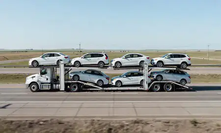 Multi-level car carrier on the highway to West Fargo, North Dakota, United States