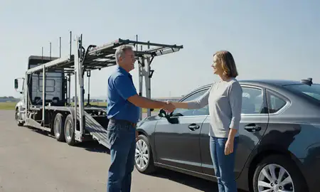 Vehicle owner beside their delivered car in Williston, North Dakota, United States