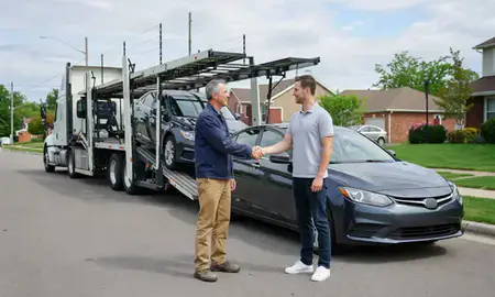 Vehicle owner beside their delivered car in Columbus, Ohio, United States