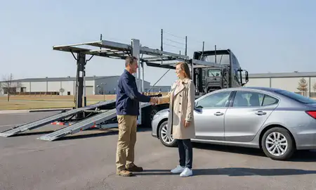 Vehicle owner beside their delivered car in Strongsville, Ohio, United States